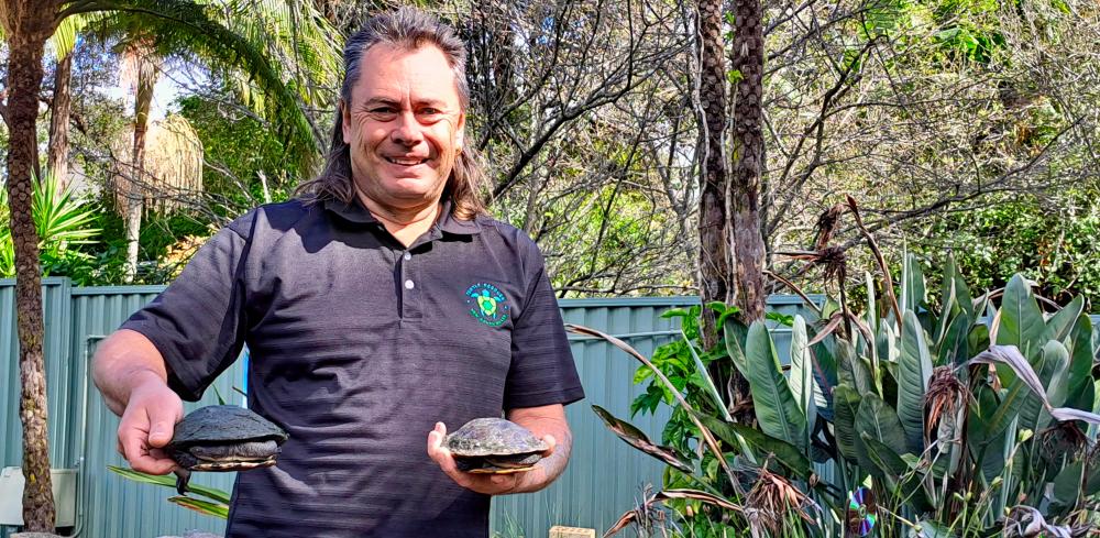 Man with two tortoises