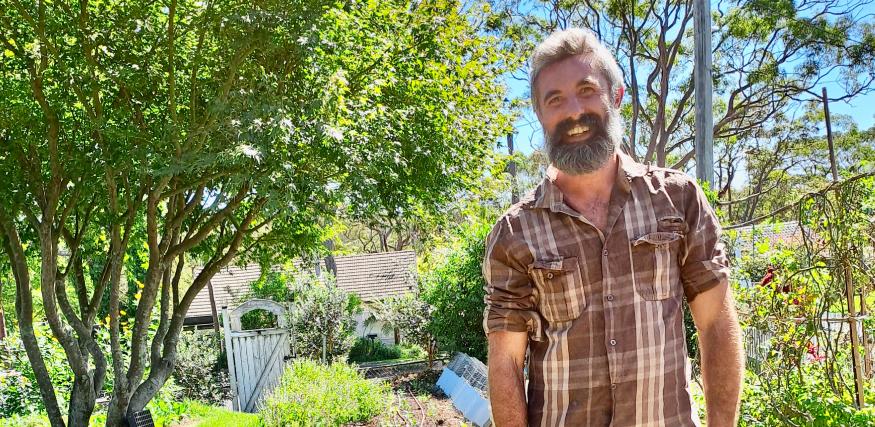 Man smiling in garden