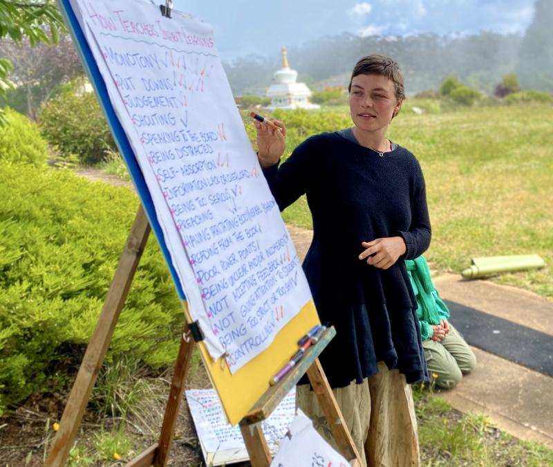 A youth writing on a board